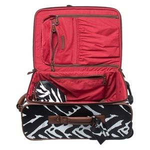 Diane Von Furstenberg limited addition B/W luggage set. Includes 4 pieces